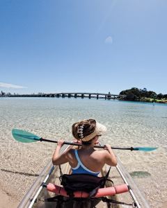 A woman kayaking at Forster, NSW