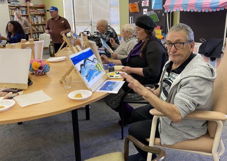 Home care participants painting